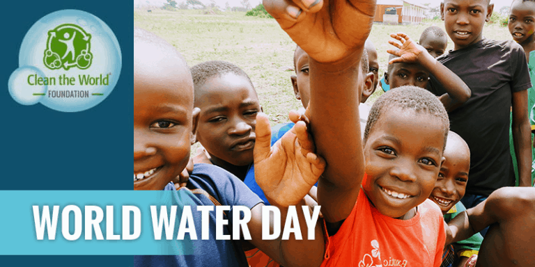Children smiling and waving in Uganda