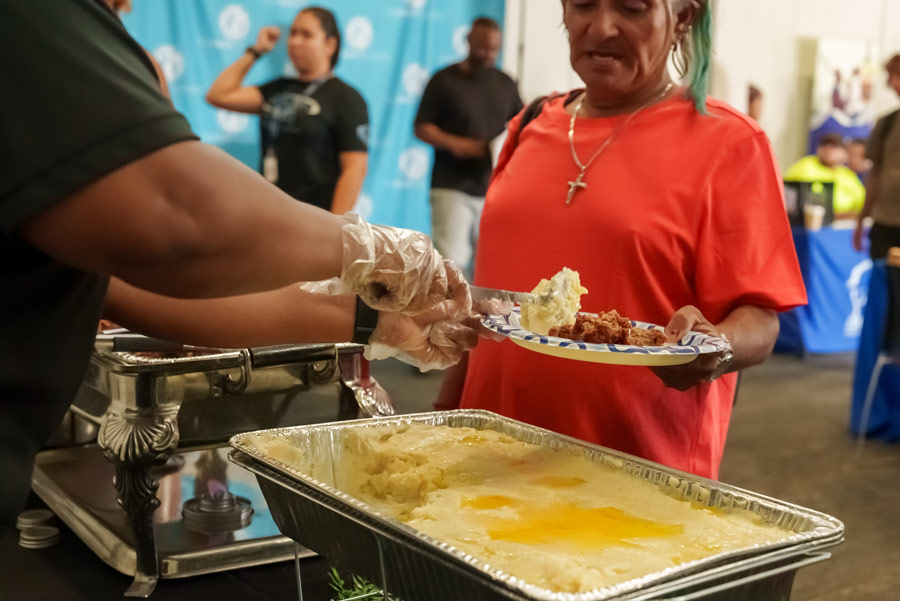 Photo of a women in line for a meal